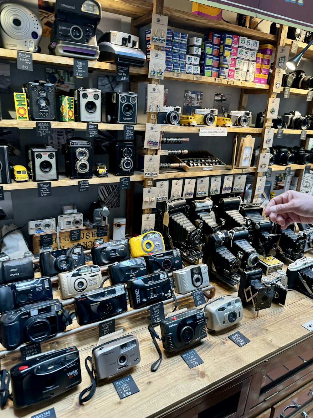 a store display with many different types of cameras