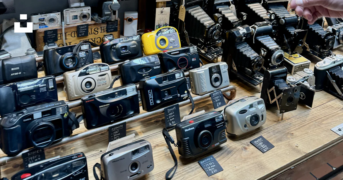 A store display with many different types of cameras photo – Free ...