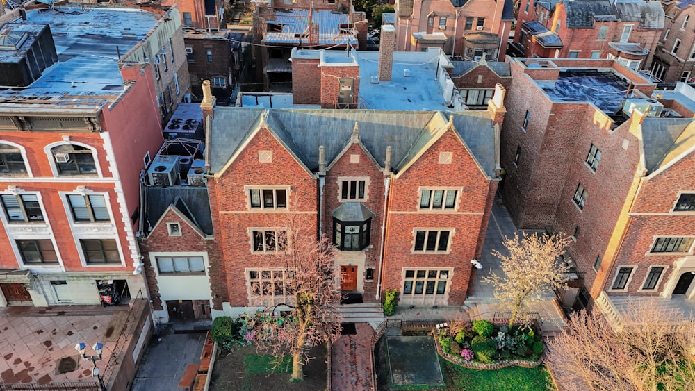 an aerial view of a brick building in a city