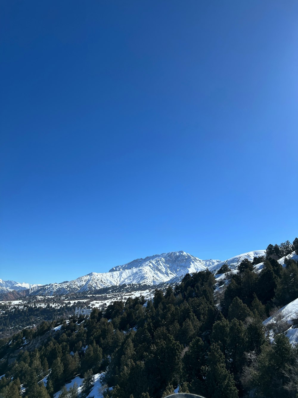 a view of the mountains from a ski slope