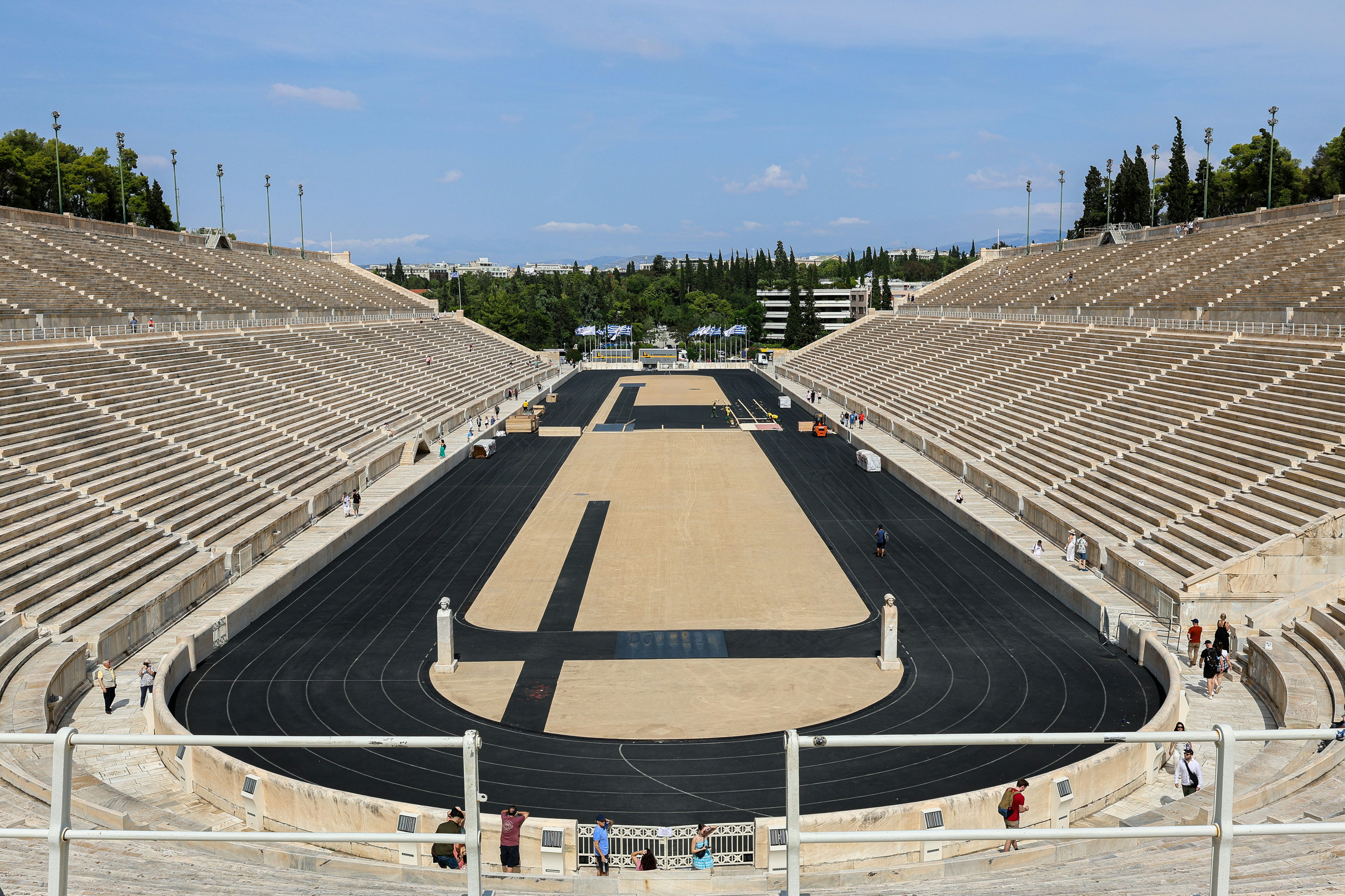 a large empty stadium with a cross on the side