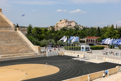a stadium with a lot of flags in front of it