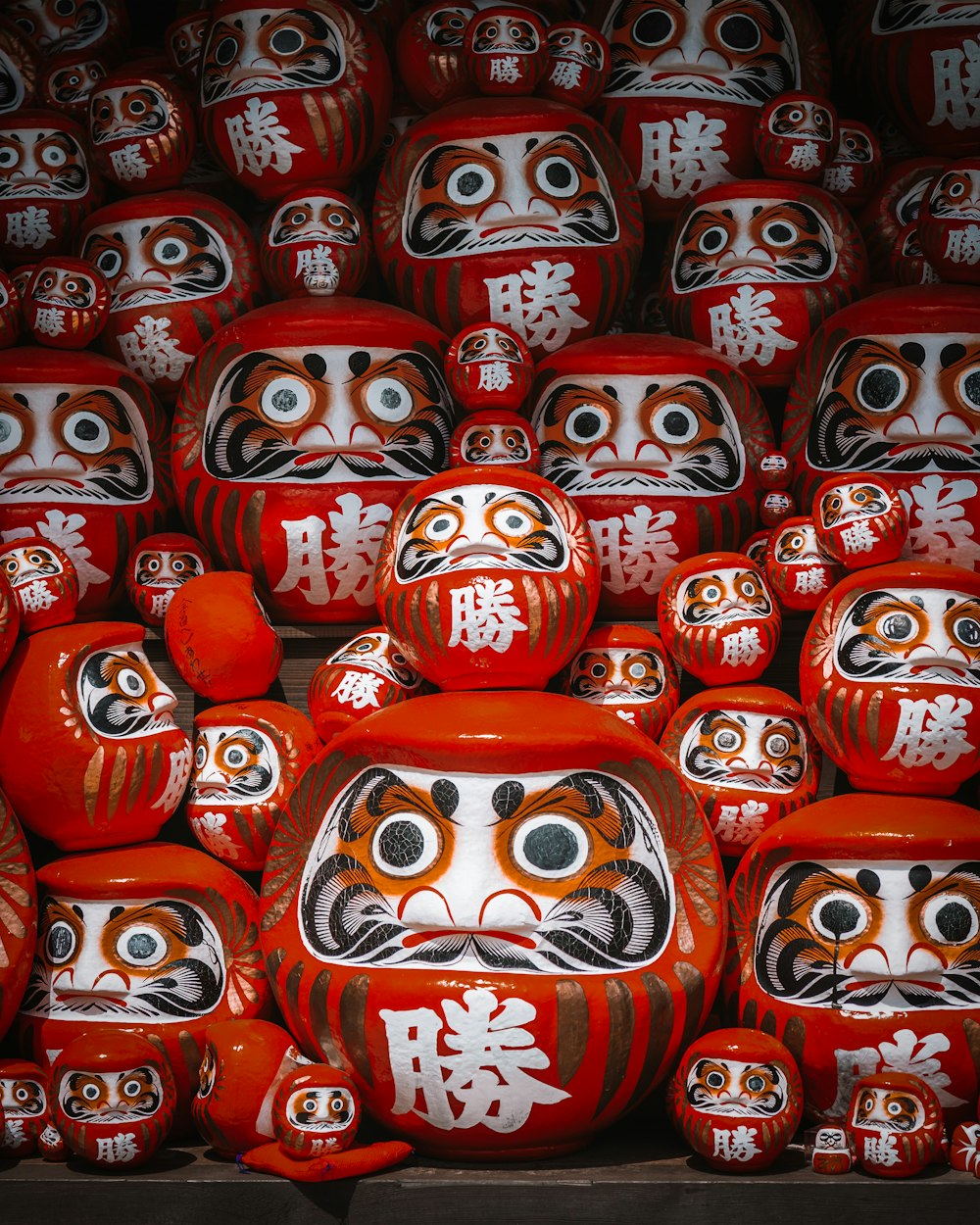 a large group of red and white masks