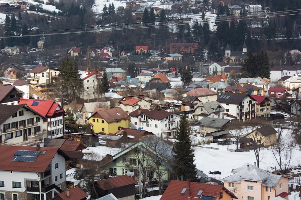 a city with lots of houses in the snow