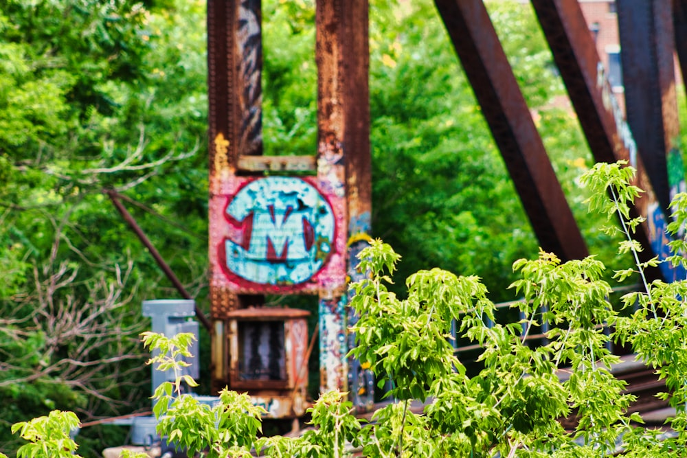 a train bridge with graffiti on the side of it