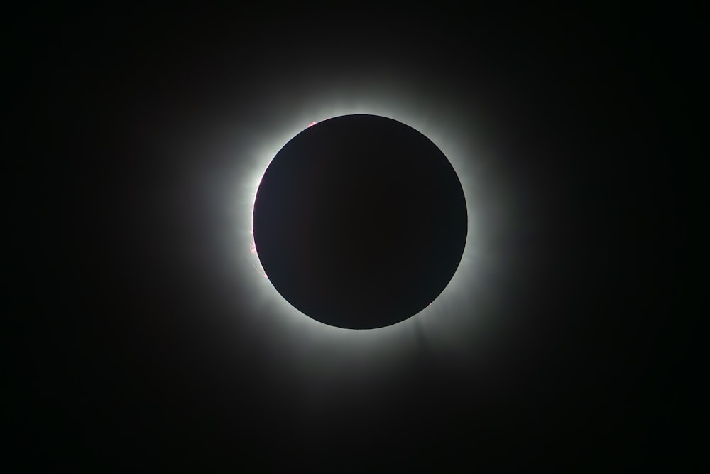 a solar eclipse in the dark sky