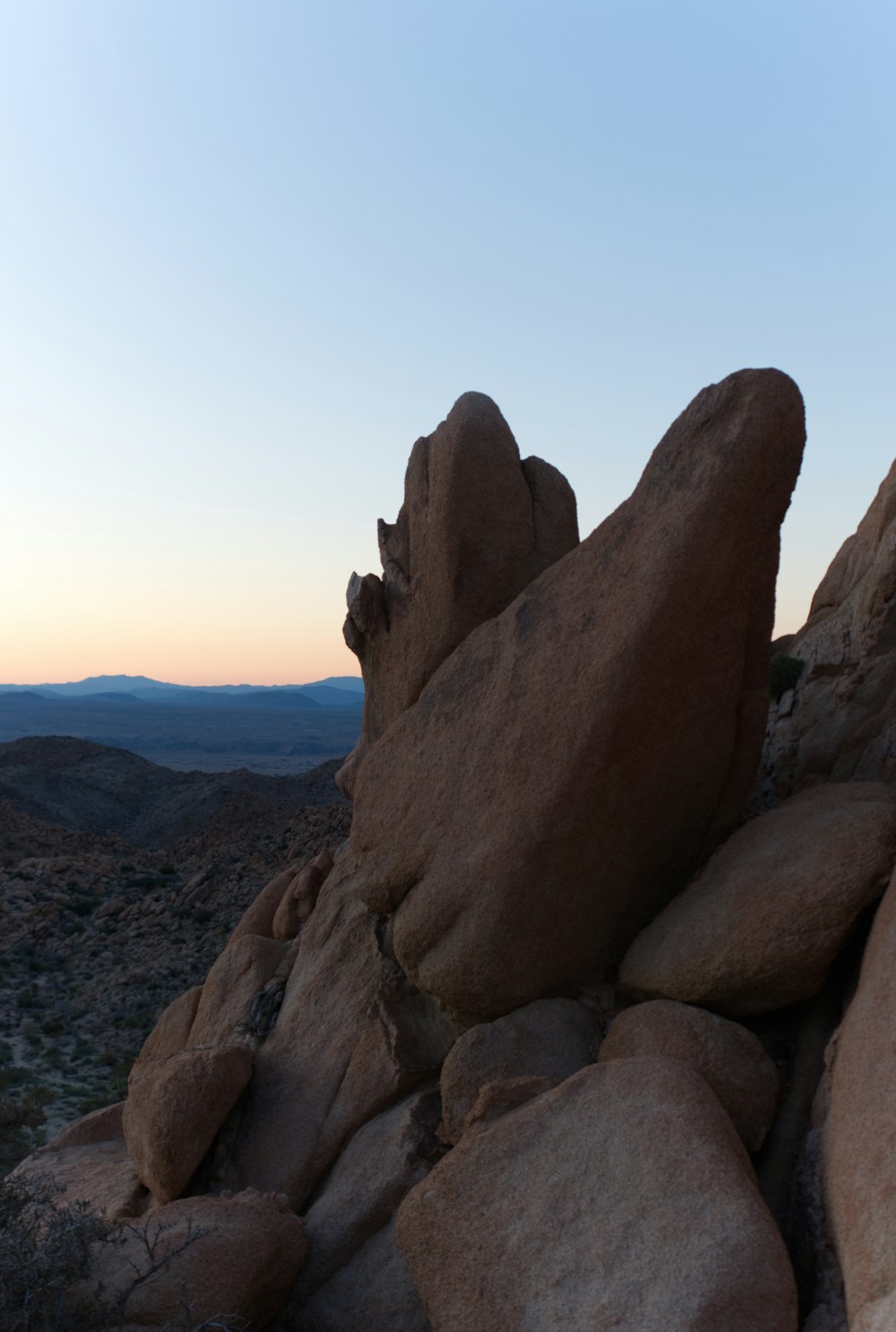 a rock formation in the middle of a desert