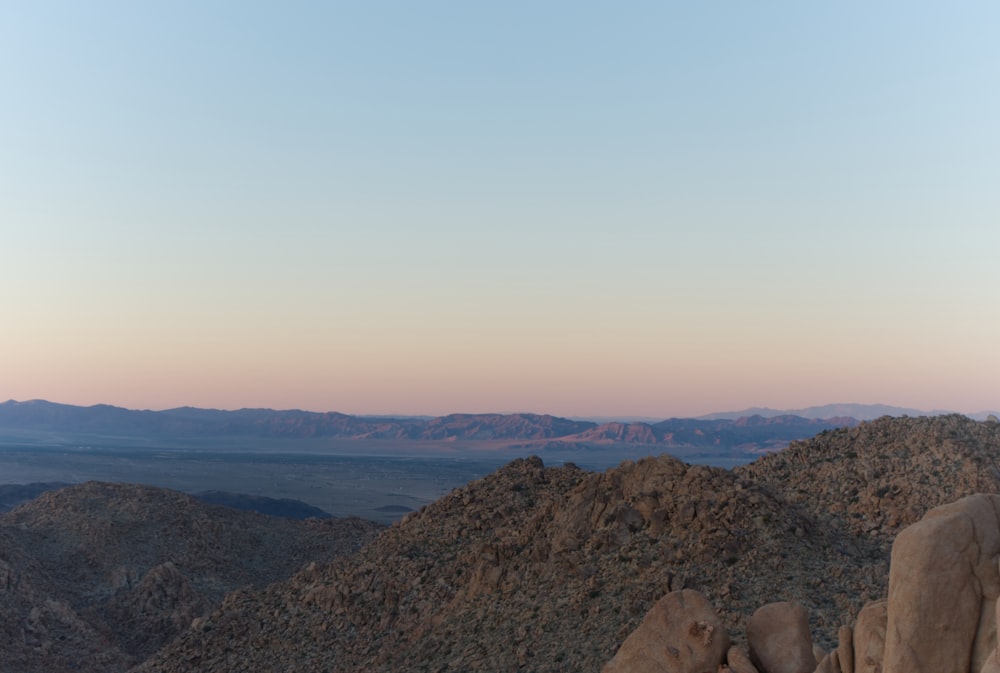 a view of a mountain range at sunset