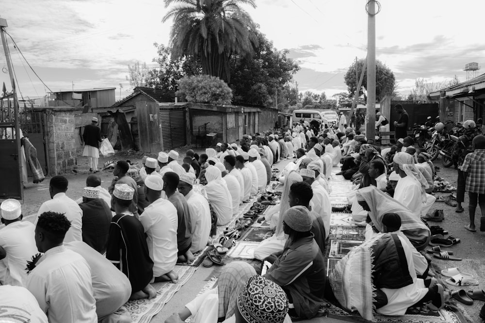 a large group of people sitting around a table