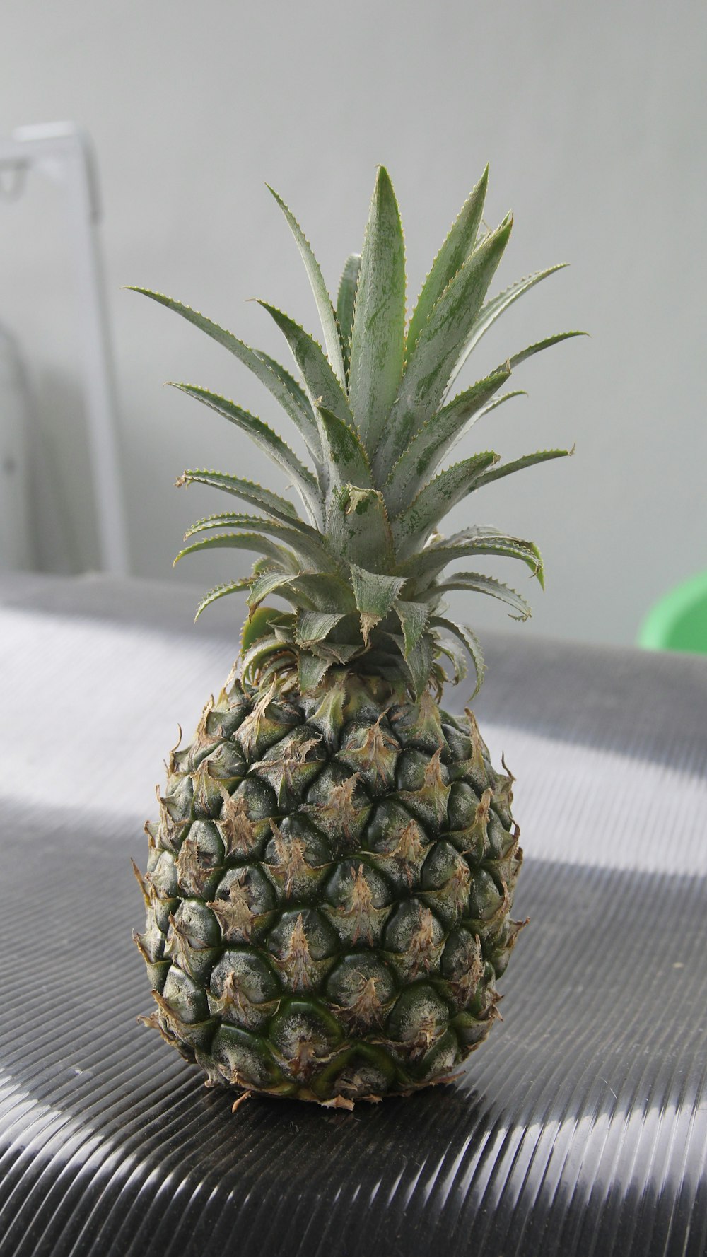 a pineapple sitting on top of a table