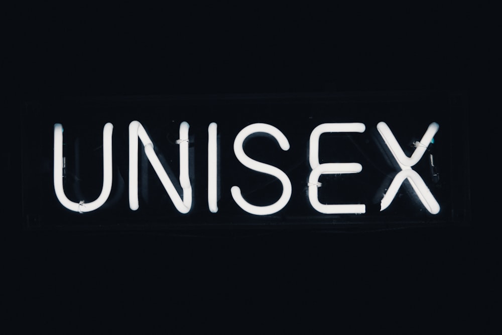 a neon sign that reads unisex