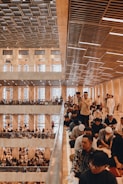 a large group of people sitting in a building