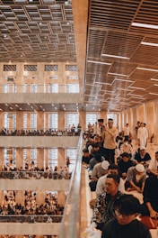 a large group of people sitting in a building