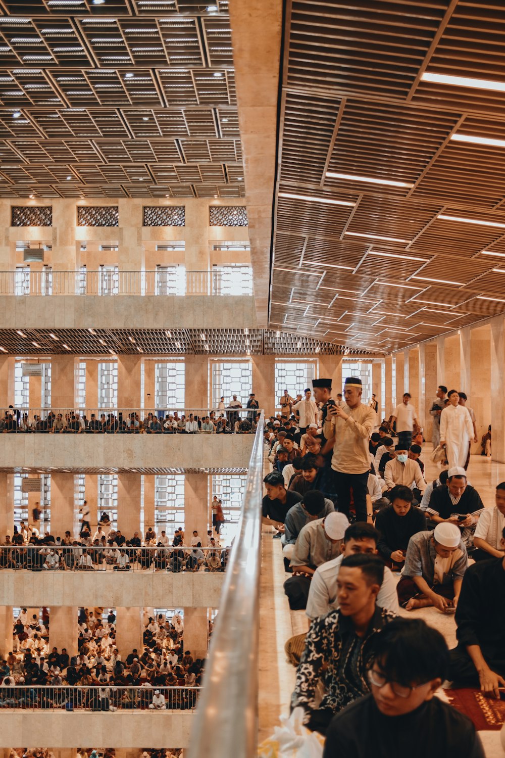 a large group of people sitting in a building