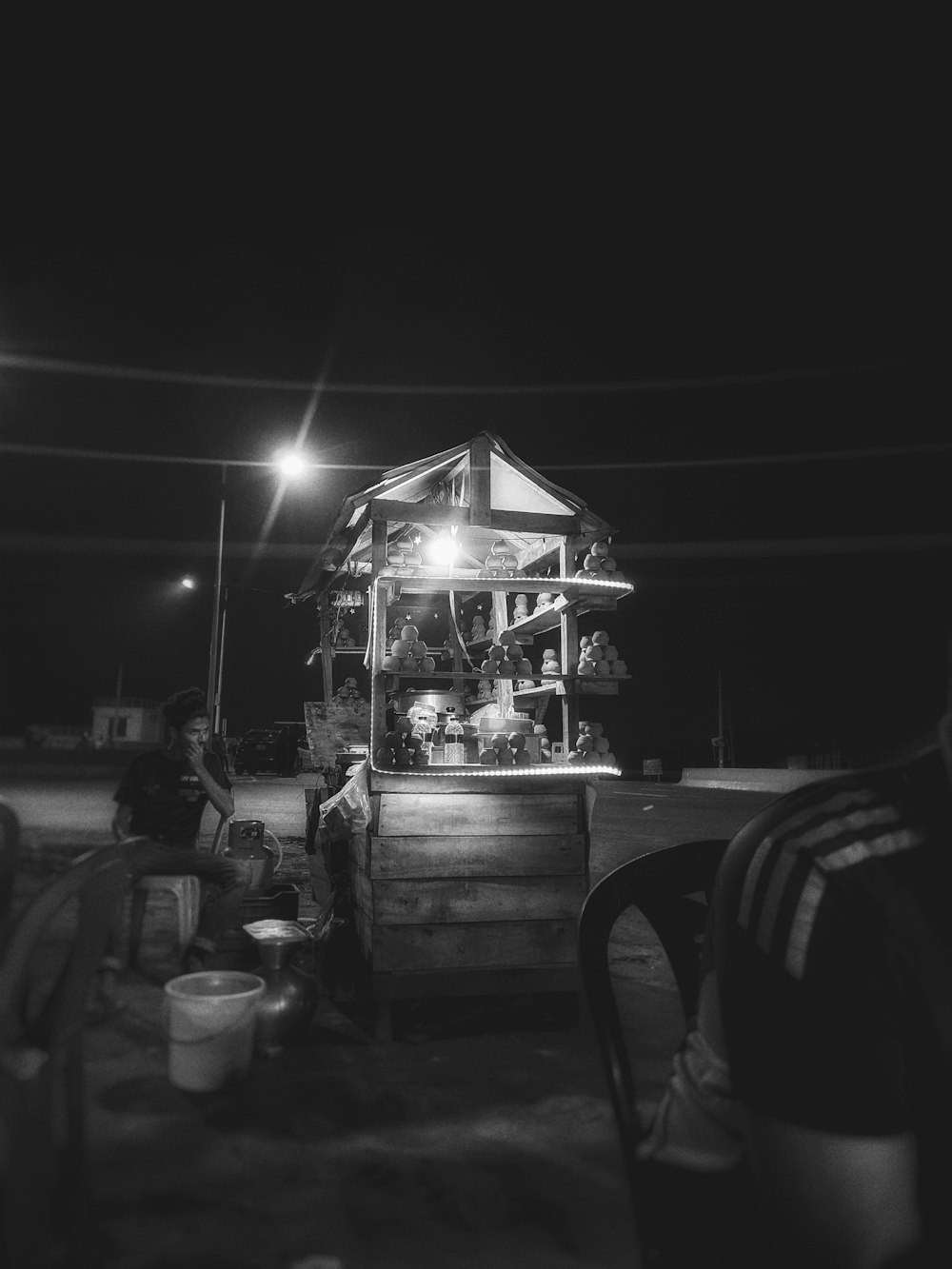 a group of people sitting around a table at night