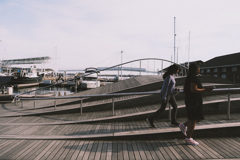 a couple of people that are standing on some steps