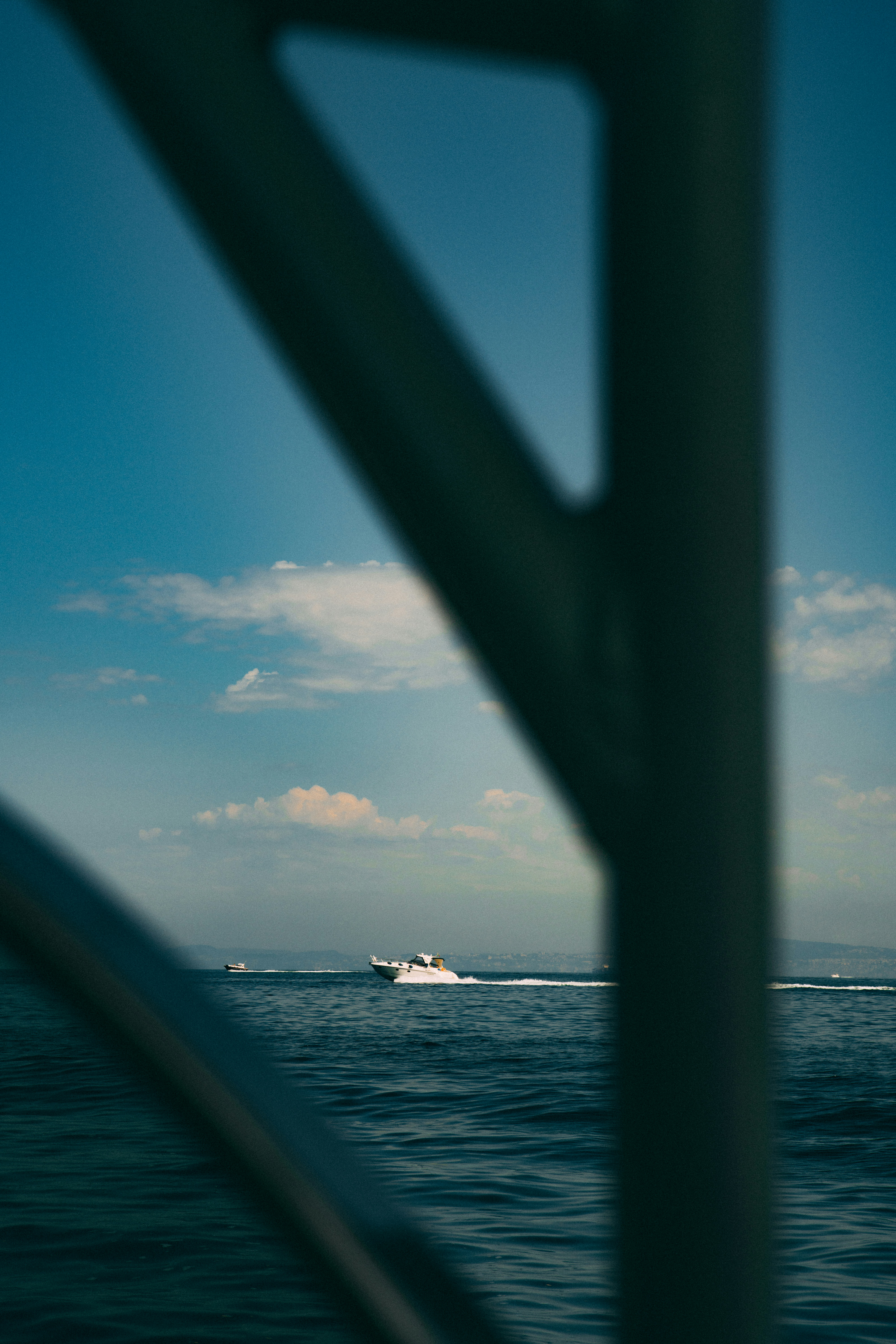 a boat in the ocean with a sky background