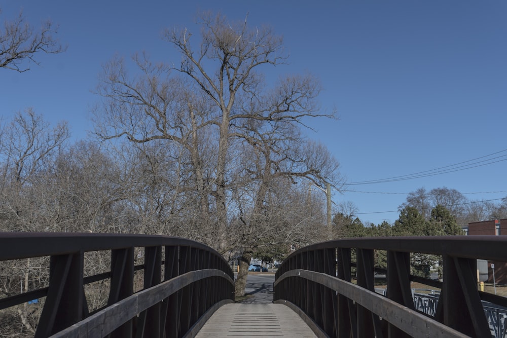 a bridge that has a tree in the background