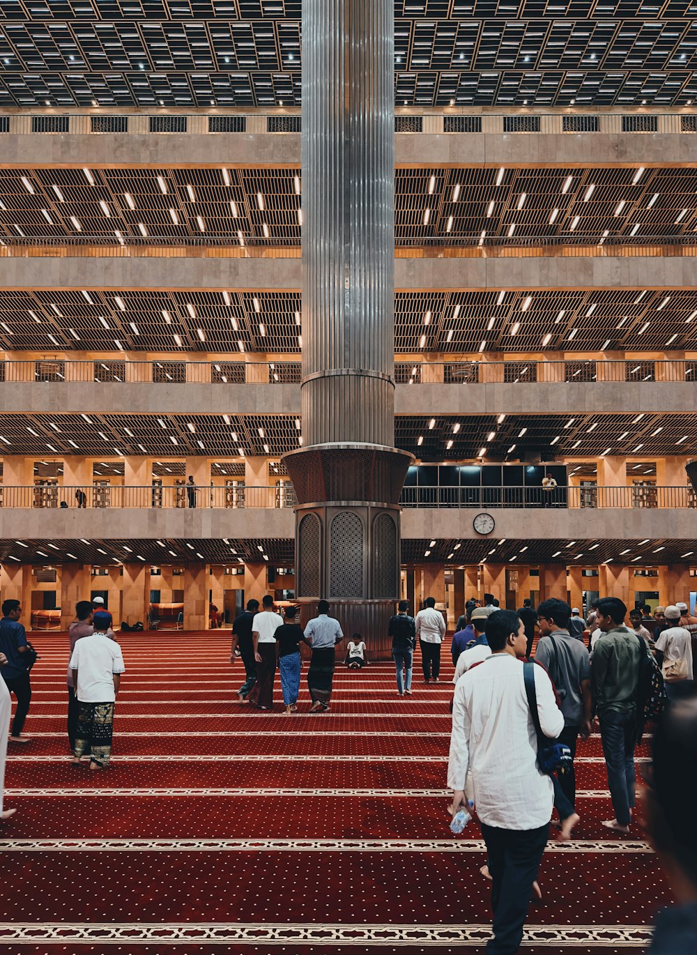 a group of people walking around a building