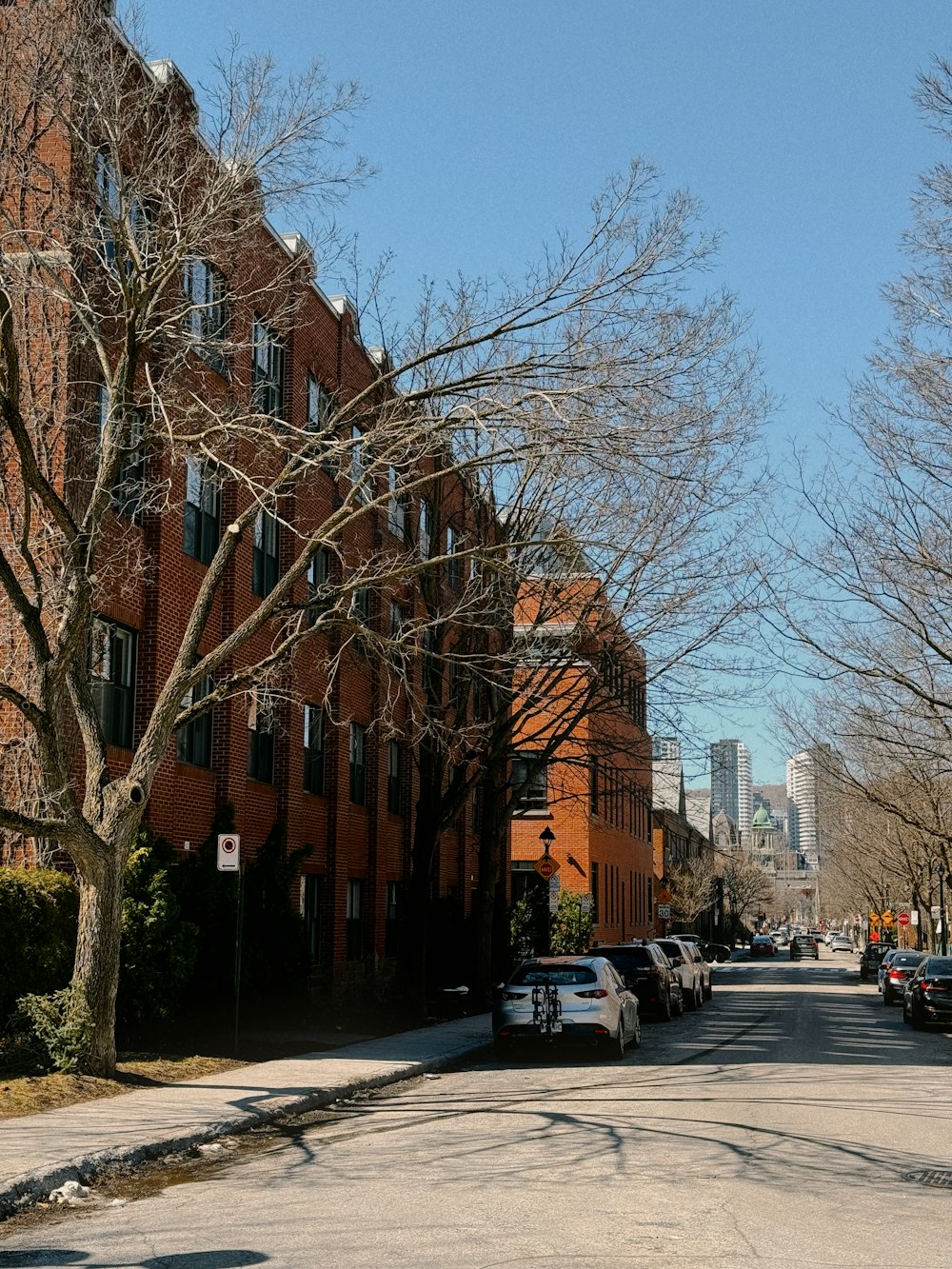 a street with cars parked on the side of it