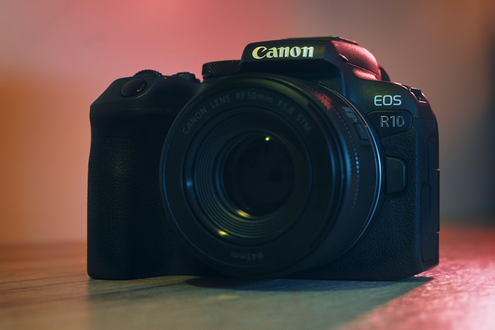 a camera sitting on top of a wooden table