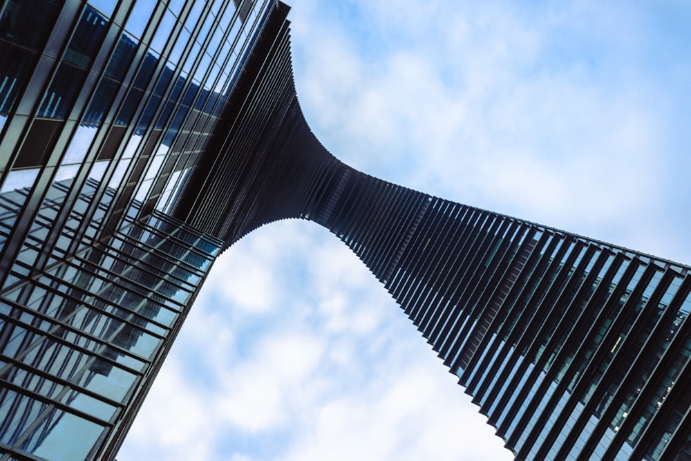 a very tall building with a sky background