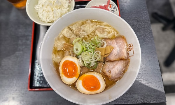 A bowl of ramen with an egg on top