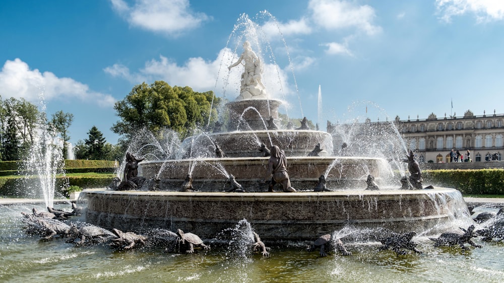 a fountain with a statue in the middle of it