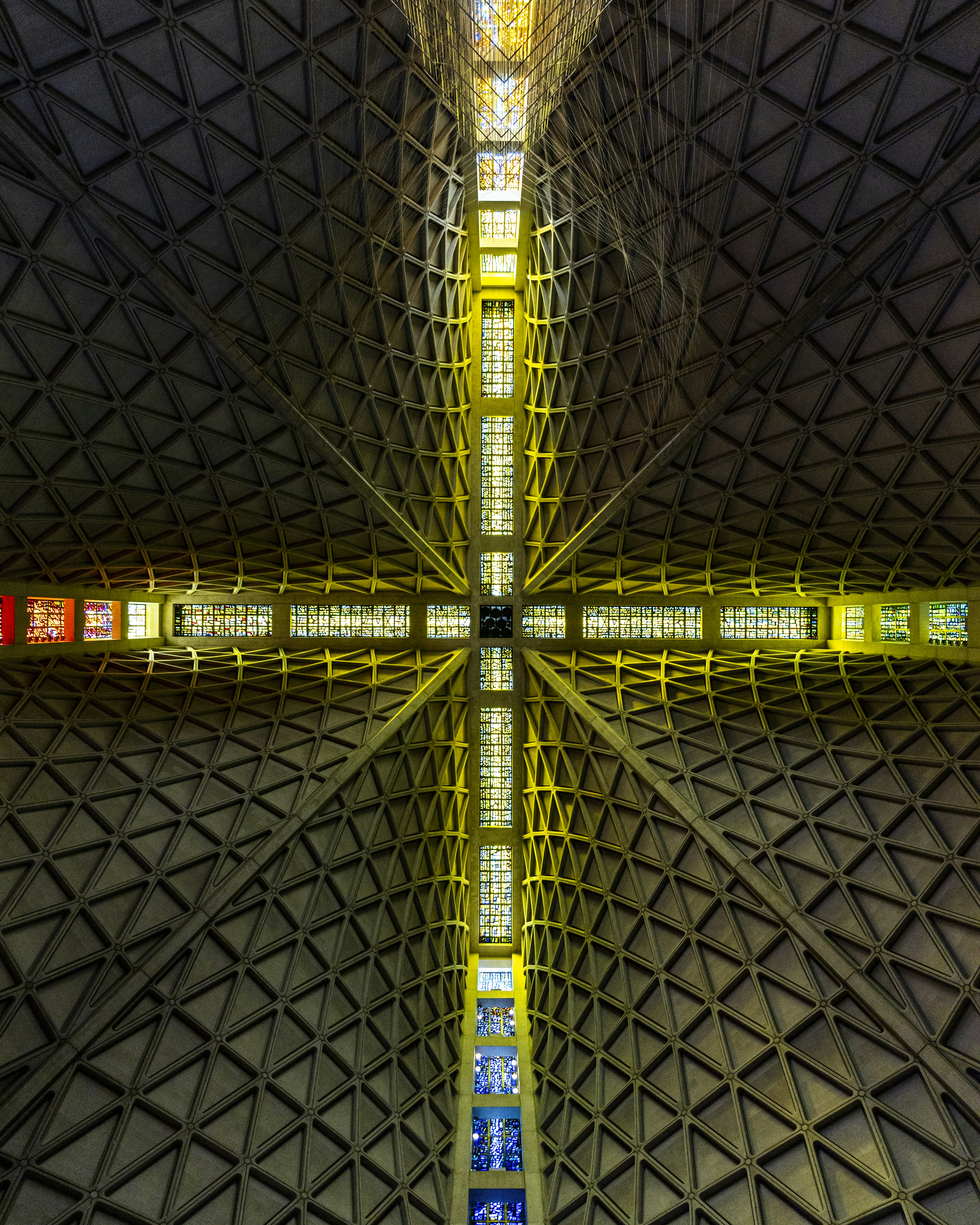 a large cross made up of many different colored lights