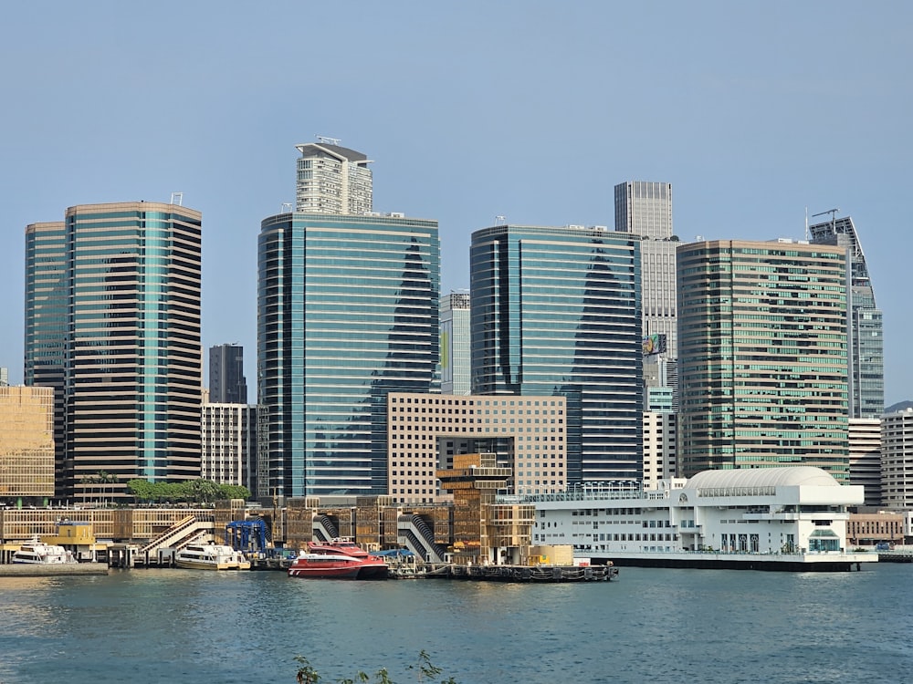 a body of water with a city in the background