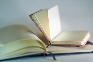 an open book sitting on top of a table