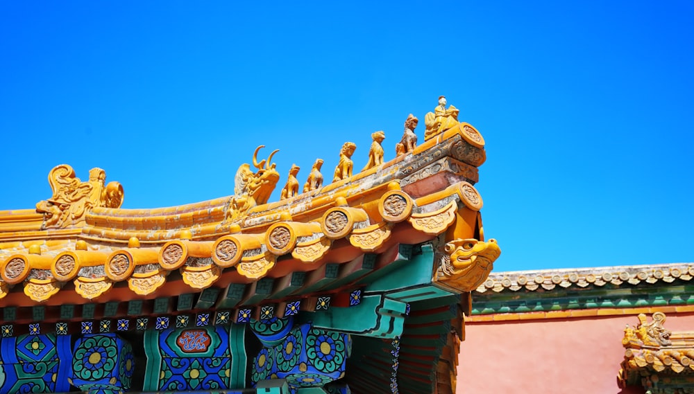 the roof of a building with a blue sky in the background