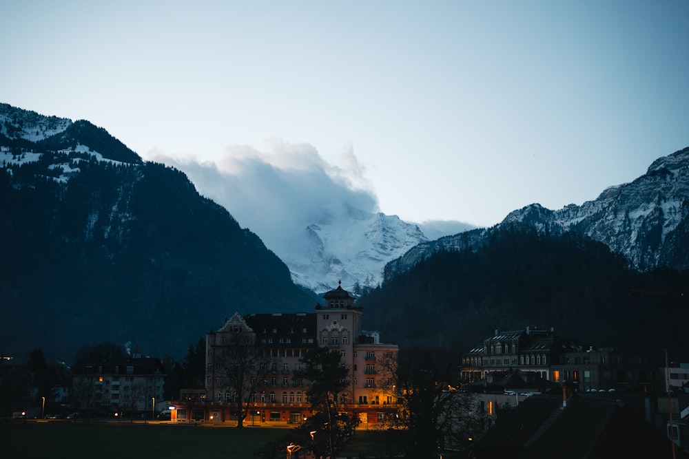 a view of a town with mountains in the background