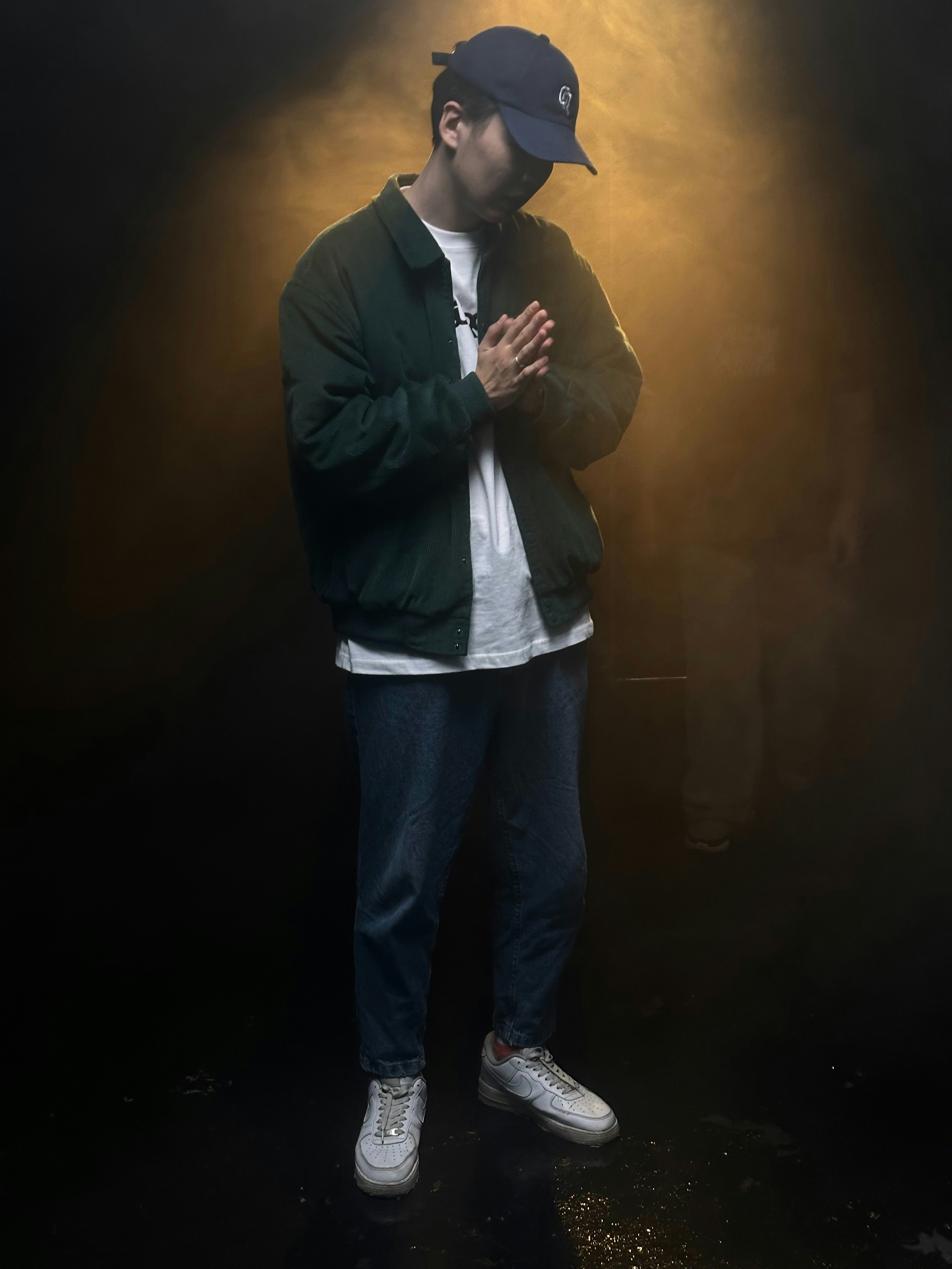 a man standing in front of a spotlight