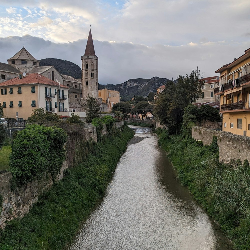 a river running through a city next to tall buildings