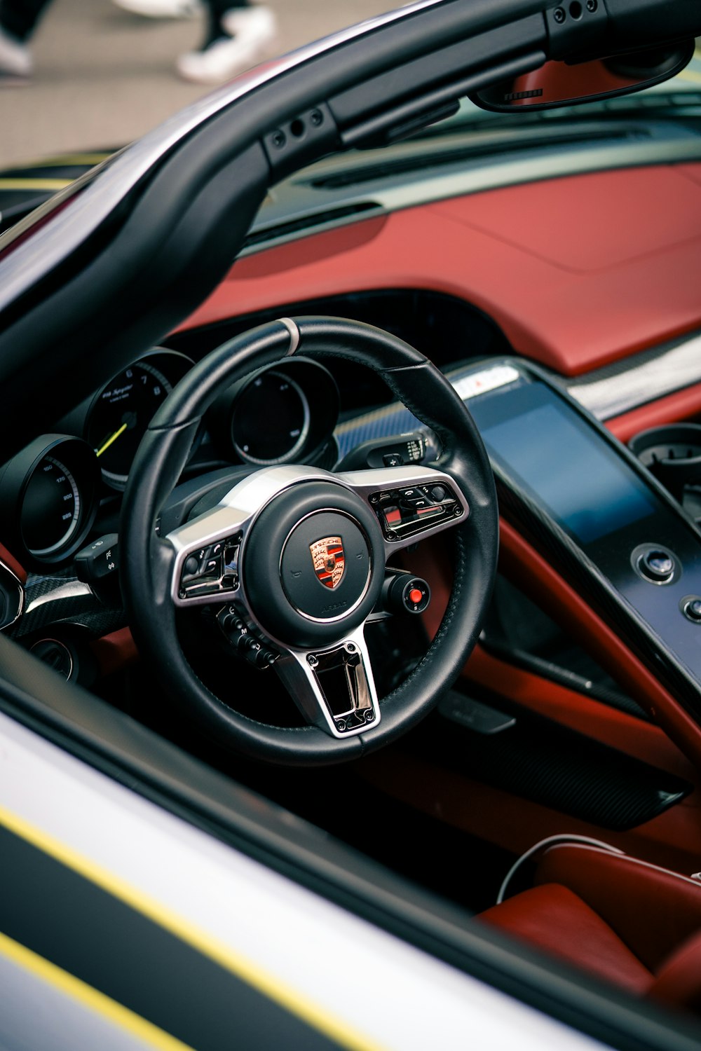 the interior of a sports car with a steering wheel