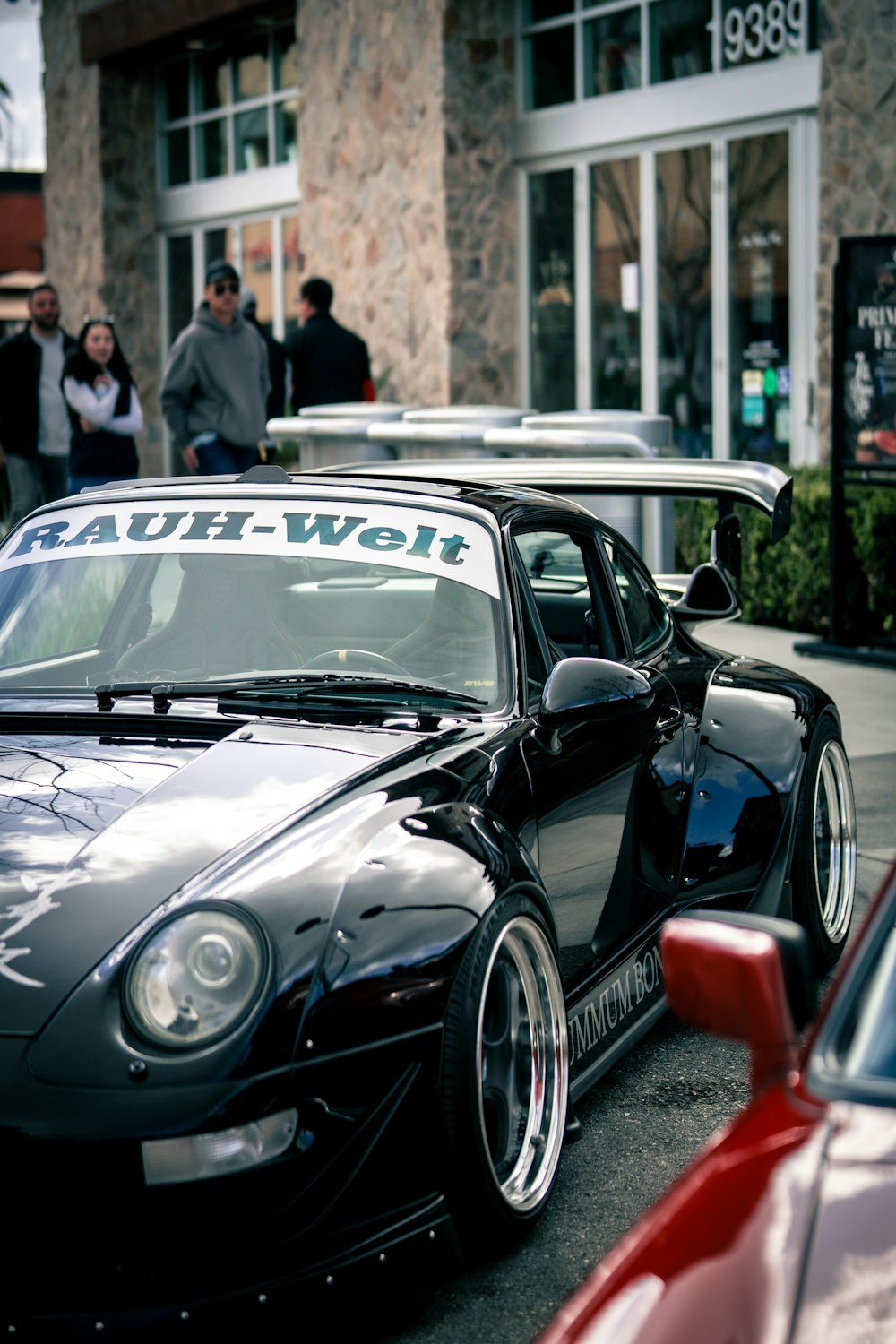 a couple of cars parked next to each other on a street