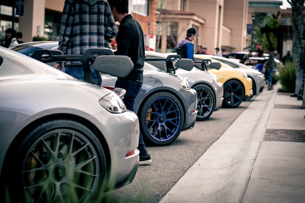 a row of cars parked next to each other on a street