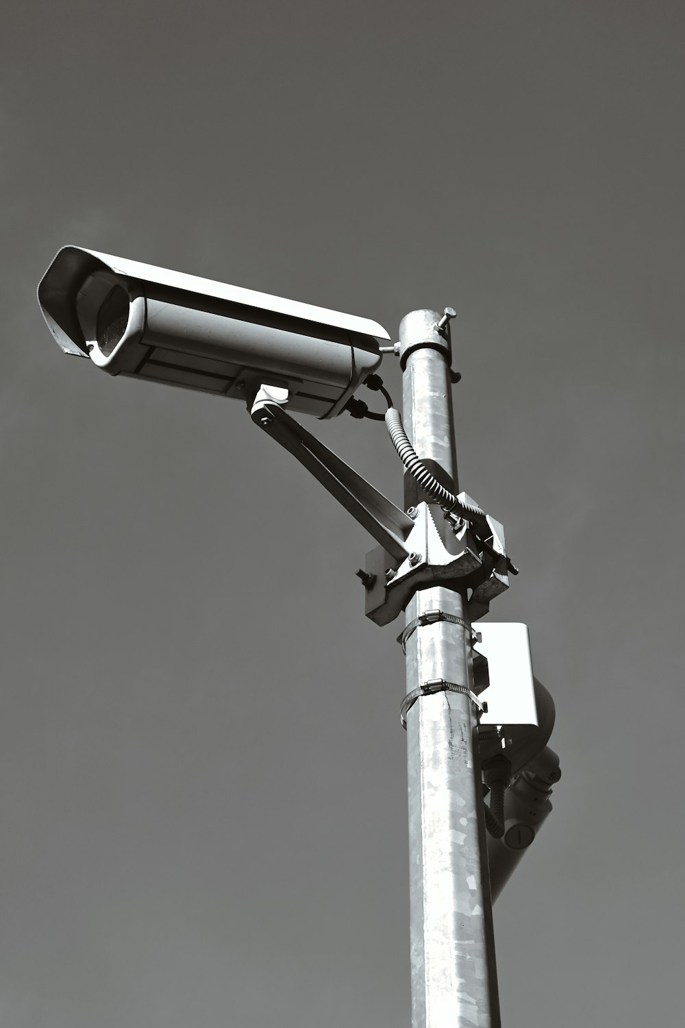 a black and white photo of a street light