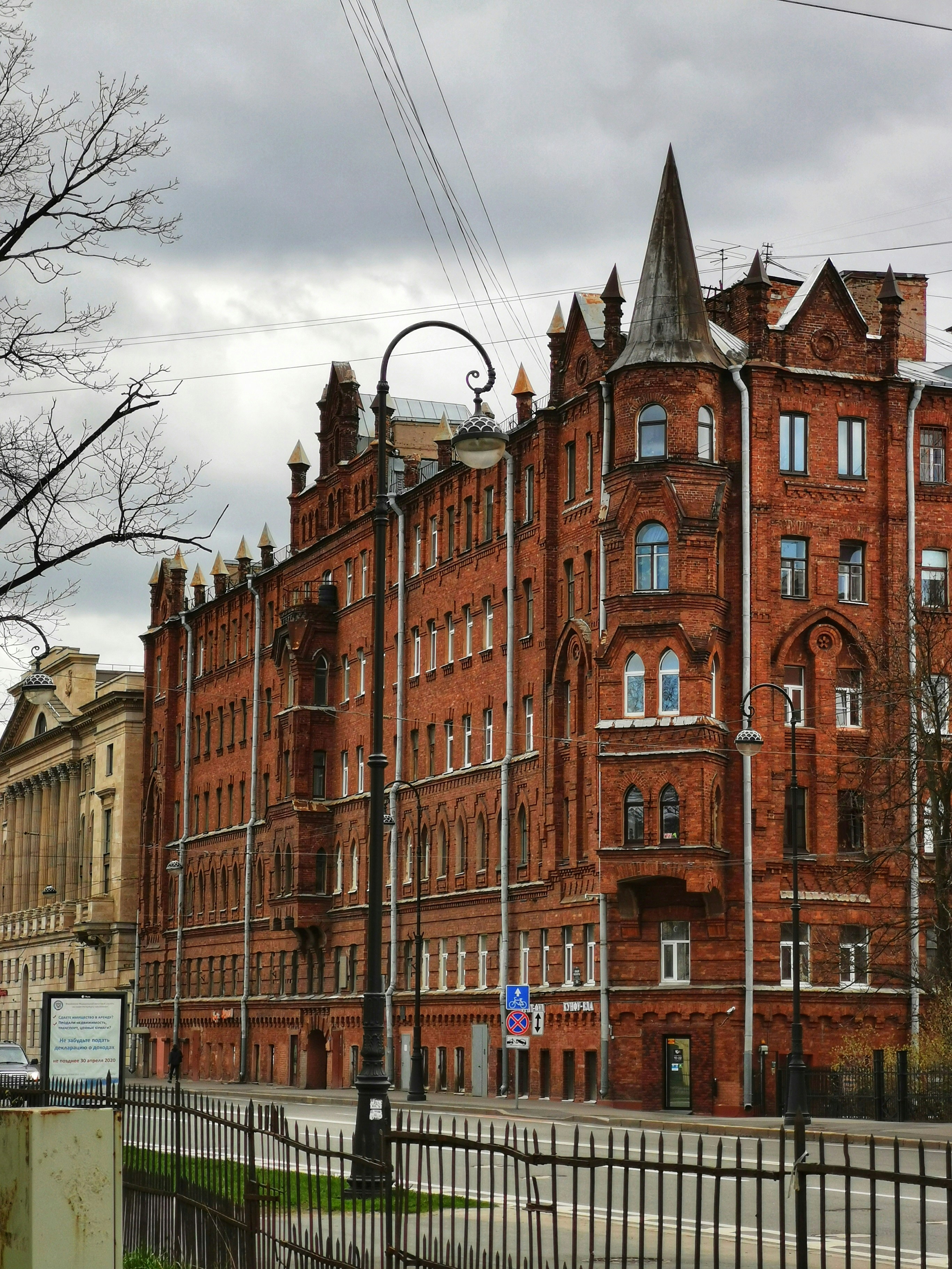 a large red brick building with a clock tower