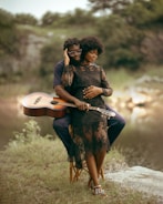 a couple of people that are sitting on a chair