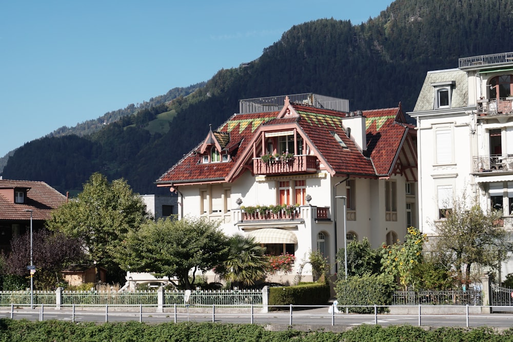 a large white house with a red roof