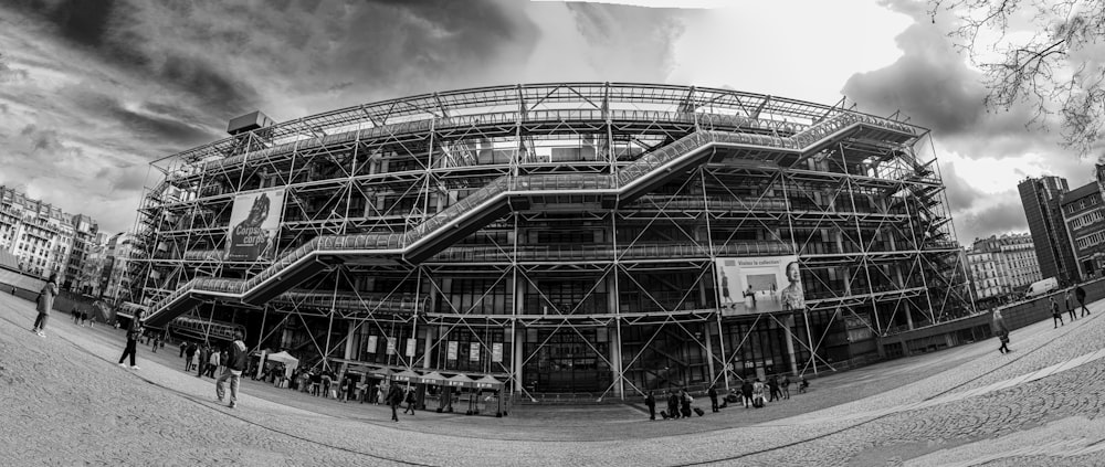 a black and white photo of a building under construction