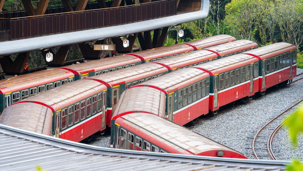 a train yard with many trains on the tracks