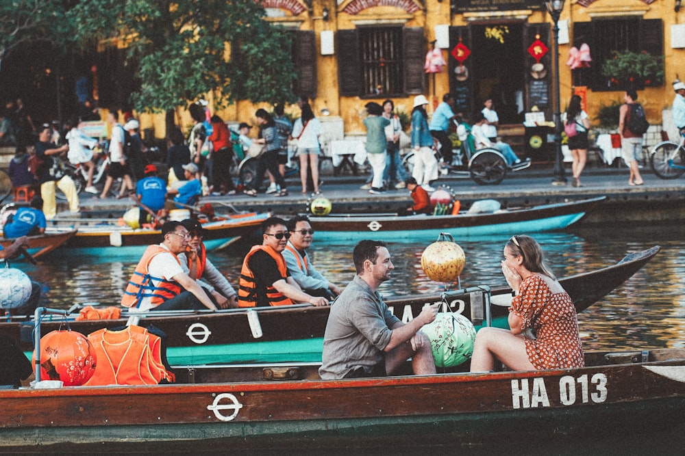 a group of people riding on top of a boat