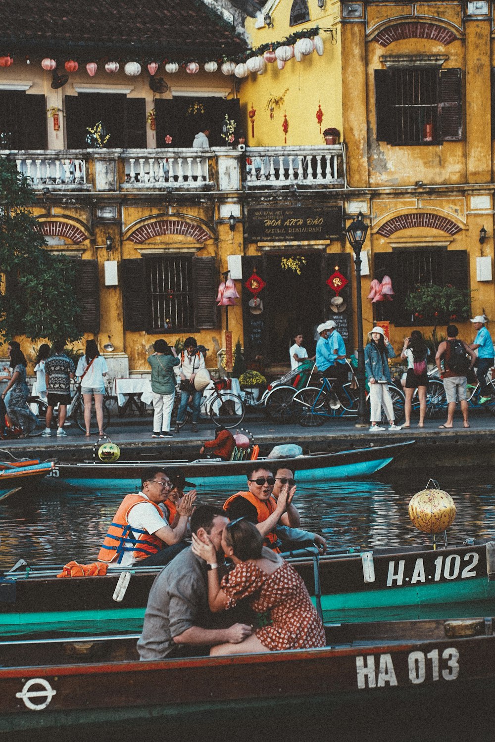 a group of people riding on top of a boat