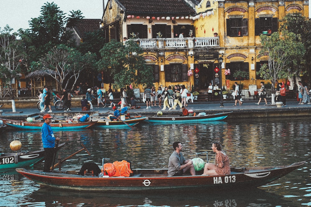 a group of people riding on top of a boat