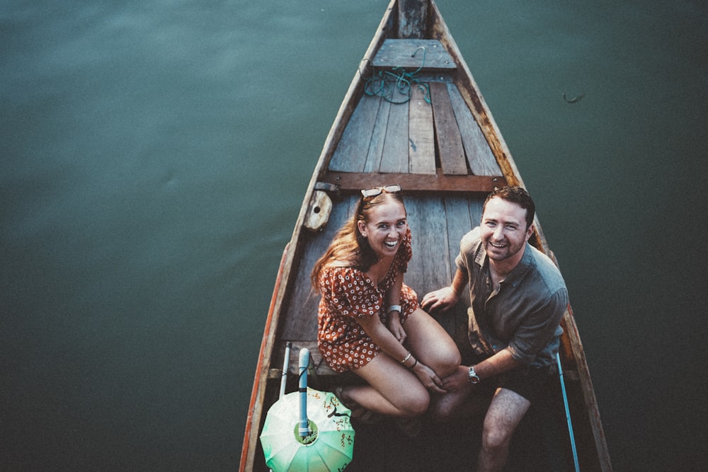 a man and a woman are sitting in a boat