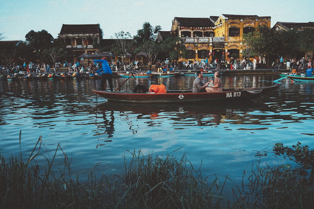 a group of people riding on top of a boat