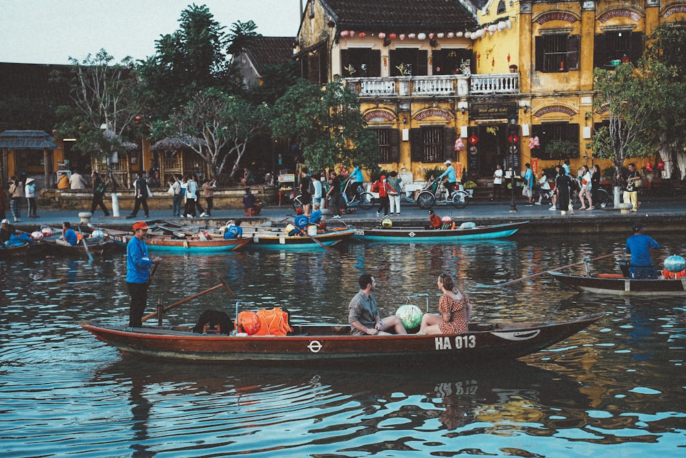 a group of people riding on top of a boat